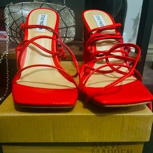 Brand new, never used. Red Steve Madden wrap around heels